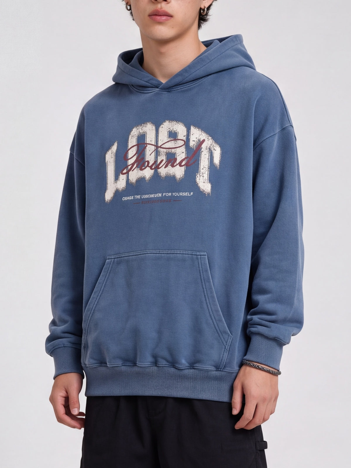 Blue Lost & Found washed hoodie with a distressed chest graphic and ribbed hem.